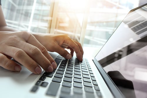 Double exposure of business man hand working on blank screen laptop computer on wooden desk as concept Double exposure of business man hand working on blank screen laptop computer on wooden desk as concept