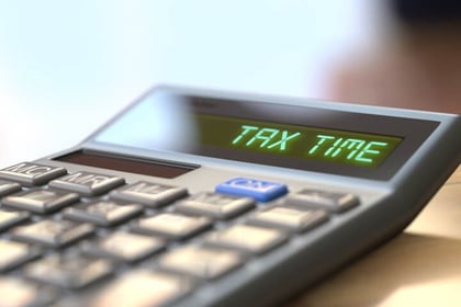 quoteinspector image - calculator reading tax time
