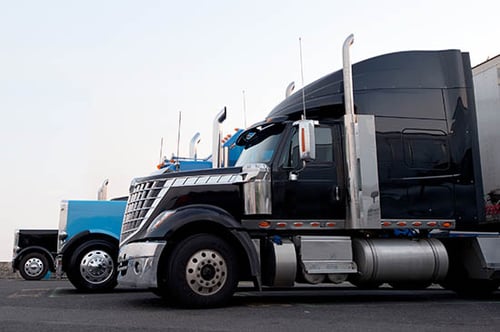 Row of semi-trailer trucks