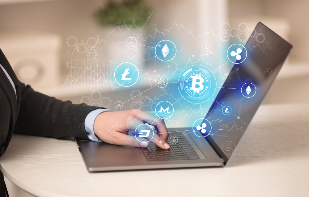 Business woman working on tablet with cryptocurrency