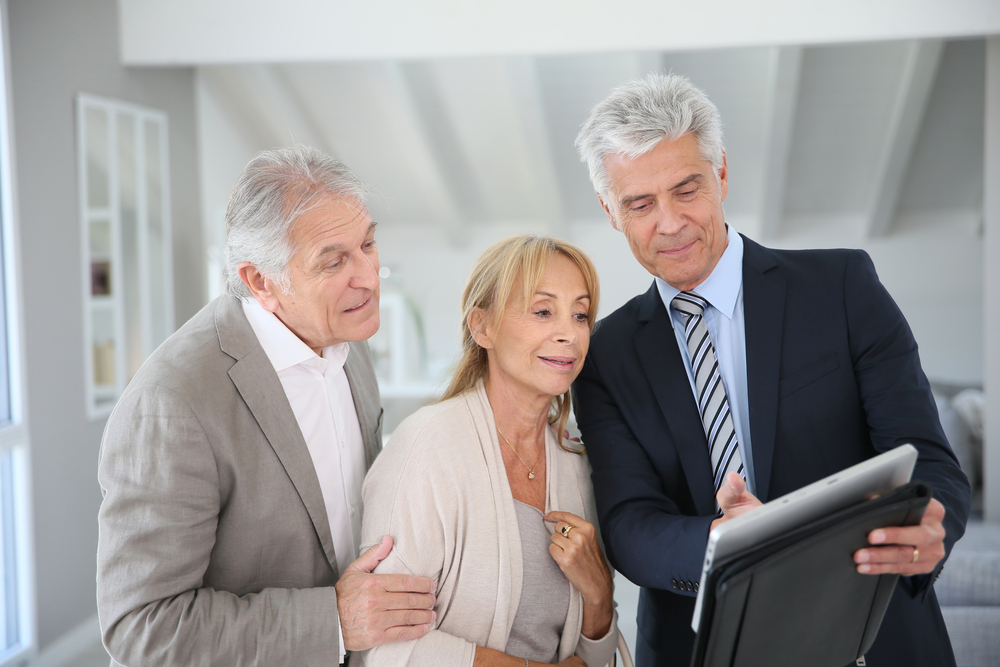 Senior couple with estate planner